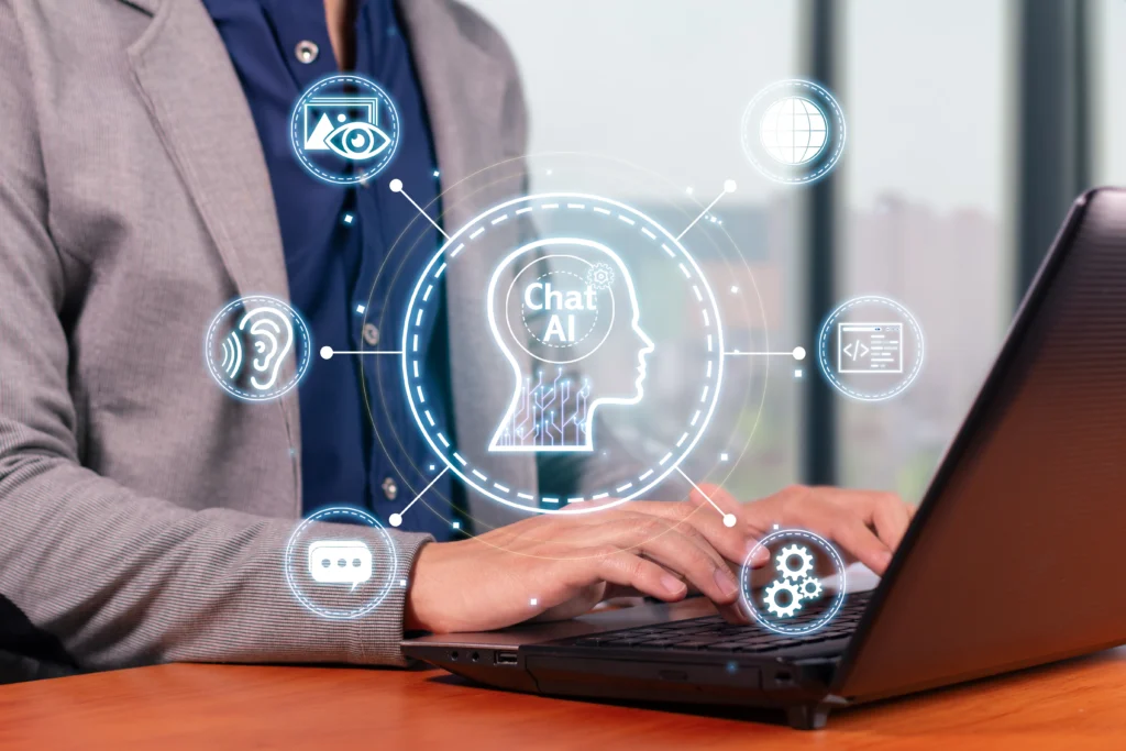 Business professional using AI-powered automation and decision-support technology on a laptop